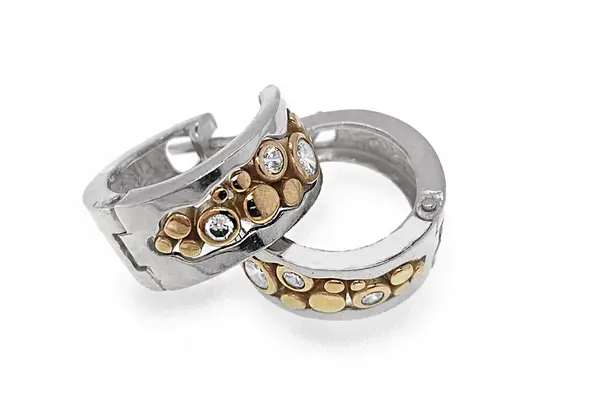 Tinted silver earrings with gold-plated details and cubic zirconia stones