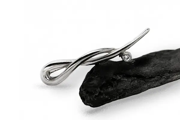 Silver brooch with crystal