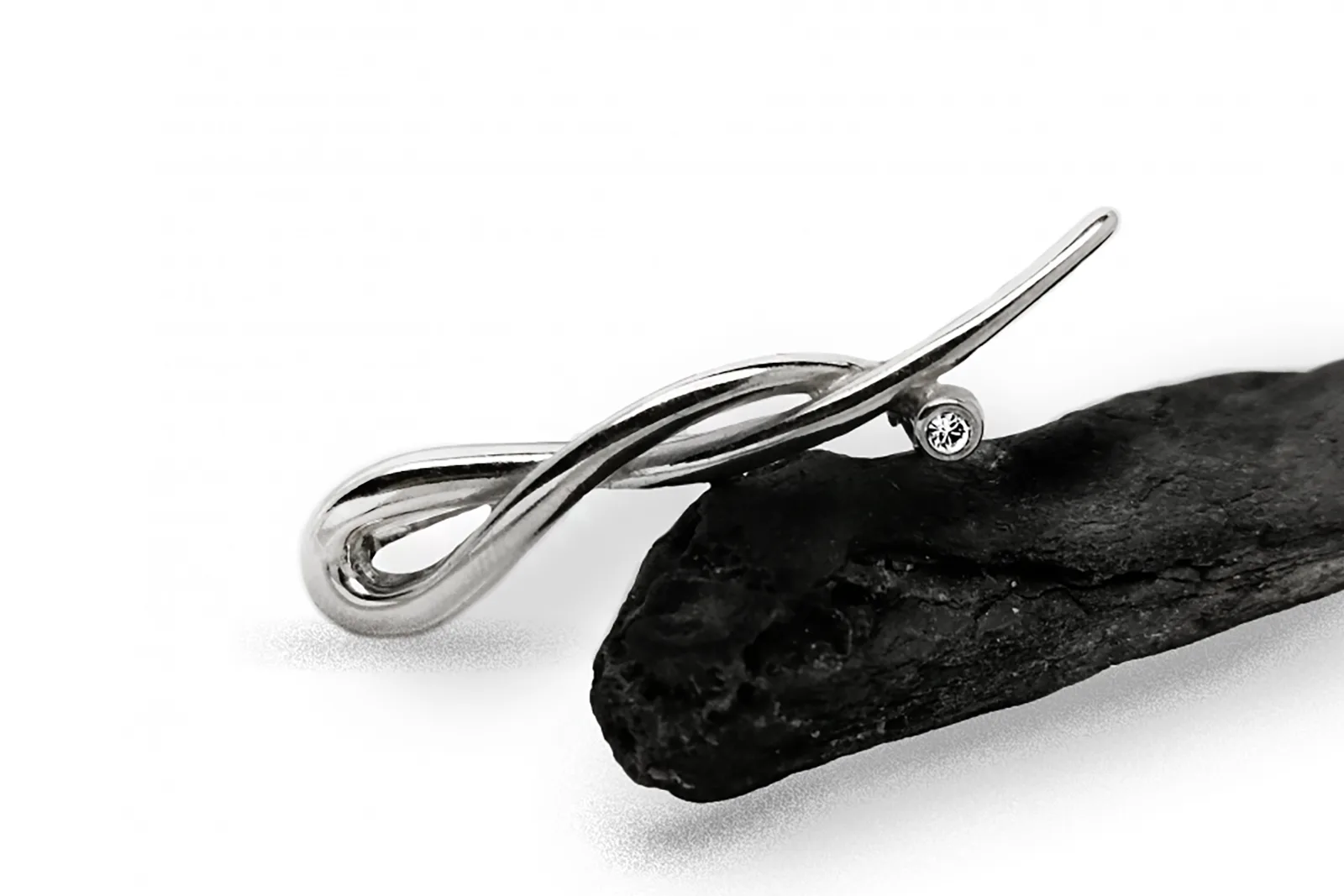 Silver brooch with crystal
